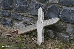 Wooden Cross alongside boundary wall 
